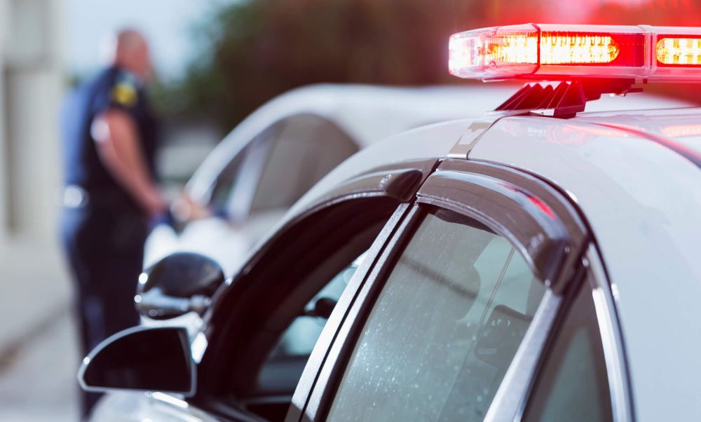 Police pulling over a car
